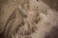 brown sand with white powder